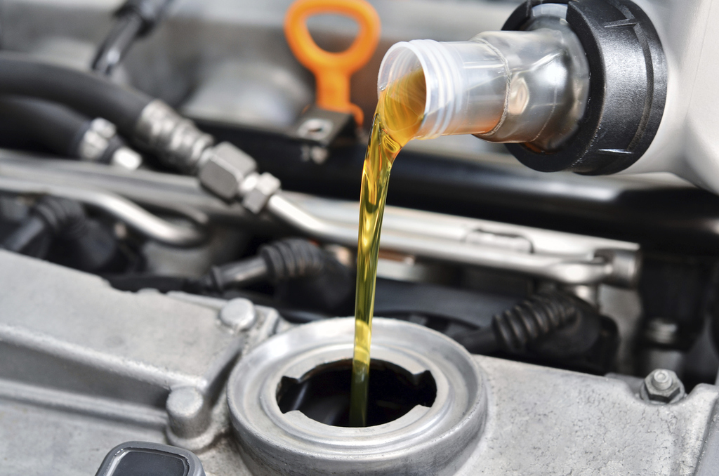 Fresh oil being poured into an engine